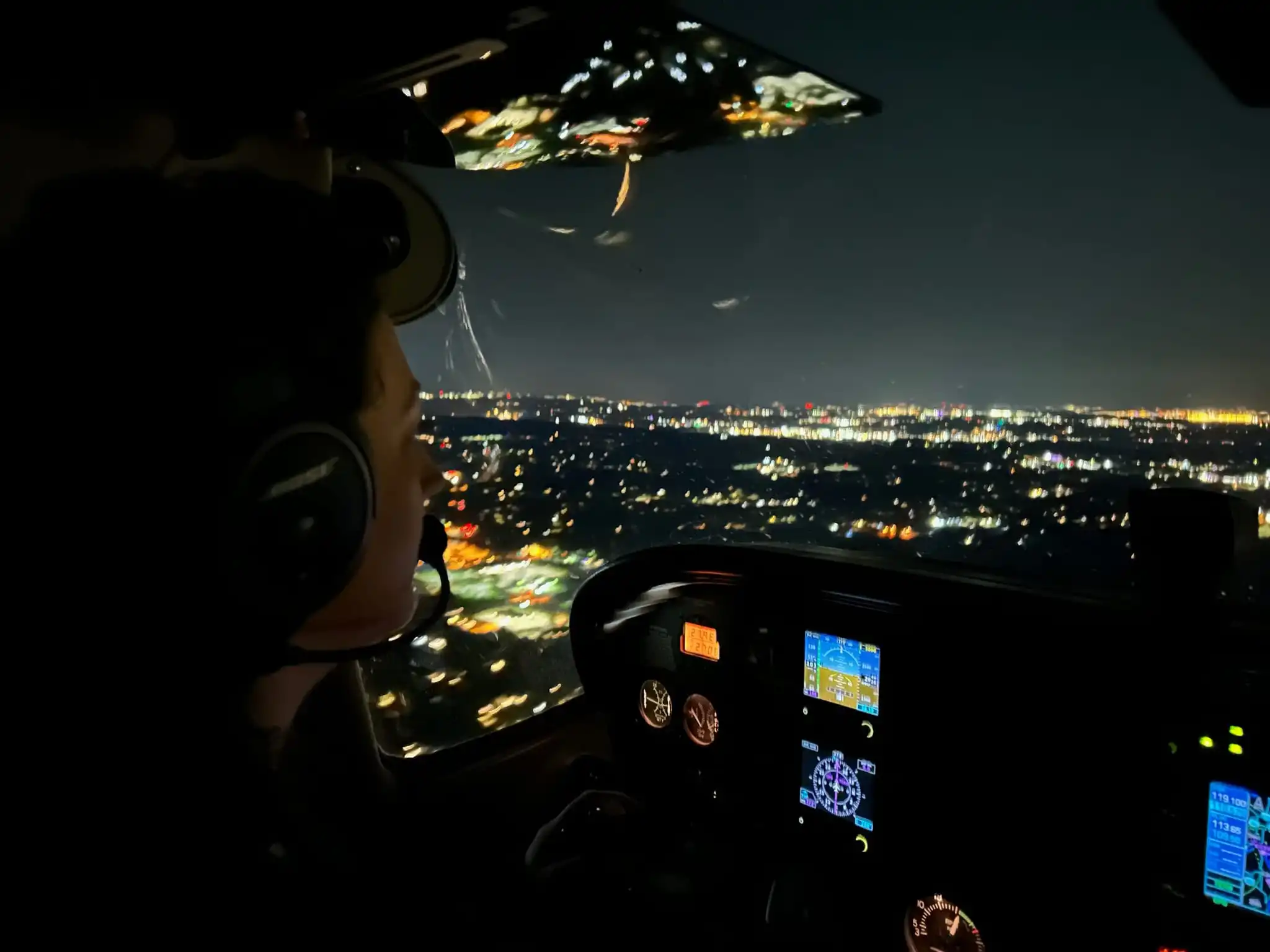 Student flying at night